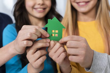 close-up-kids-holding-toy-house